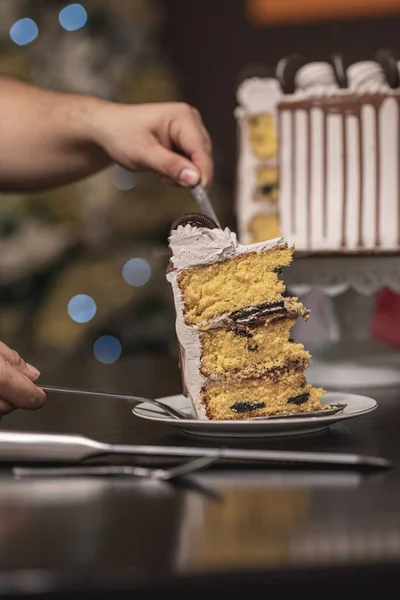 Vertical Selective Focus Shot Hand Putting Cut Section Appetizing Cake — Stock Photo, Image