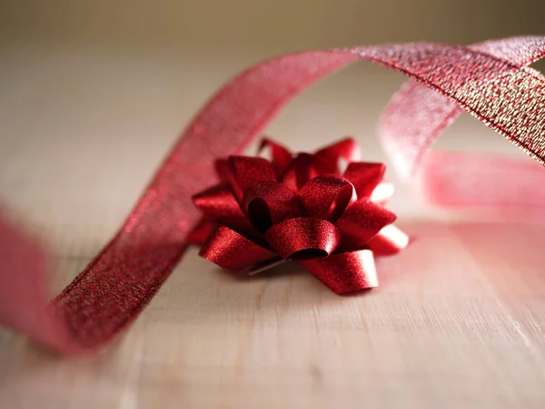 Red Christmas Bow Ribbon Wooden Background Close Shot — Stock Photo, Image