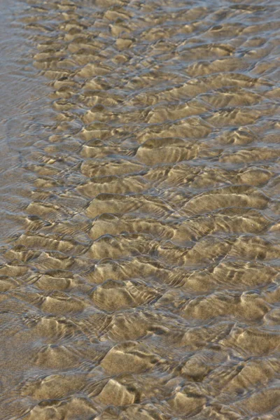 Μια Αφηρημένη Επίδραση Της Κίνησης Του Νερού Ένα Αμμώδη Πυθμένα — Φωτογραφία Αρχείου