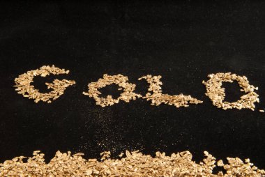 large samples of pure gold in various forms including coins, ingots, bars, dust and nuggets clipart