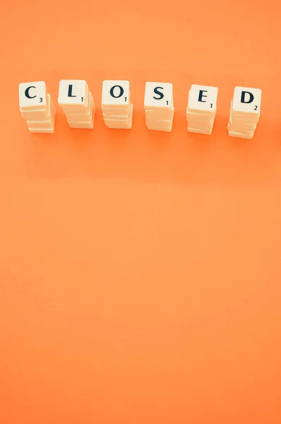 Six White Letter Block Stacks Forming Word Closed Orange Background — Stock Photo, Image