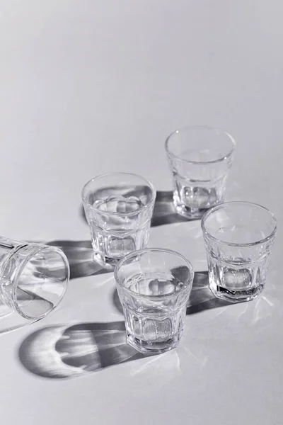 Vertical Shot Empty Rocks Glasses White Surface Shadows — Stock Photo, Image