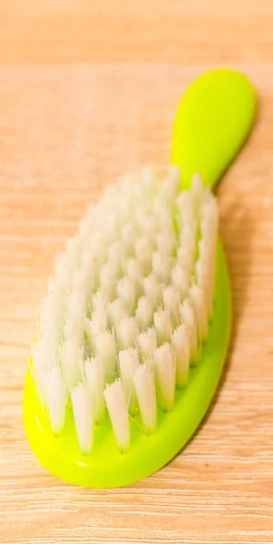 Green Hairbrush Wooden Background — Stock Photo, Image