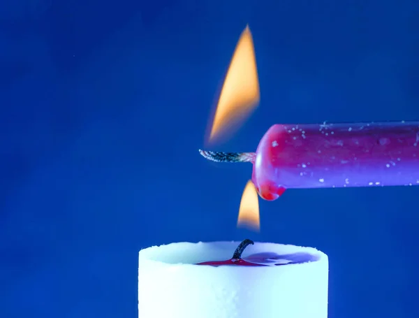 Close Shot Two Burning Candles Blue Background — Stock Photo, Image