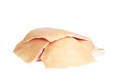 An isolated closeup of a stacked of raw pork skin on a white background clipart