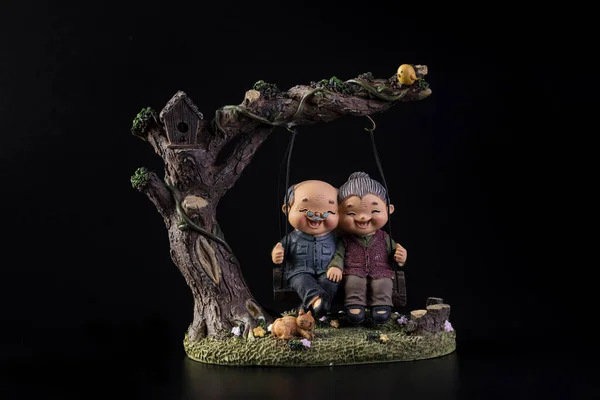 Cute Decoration Figures Elderly Cute Couple Sitting Happily Swing Tree — Stock Photo, Image