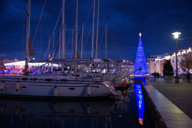 Volos city, Greece, the city of Volos decorated for the Christmas holidays,Commercial Port of Volos, ships and clipart