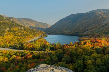 A beautiful shot of the Echo Lake in the Franconia Notch State Park in autumn clipart
