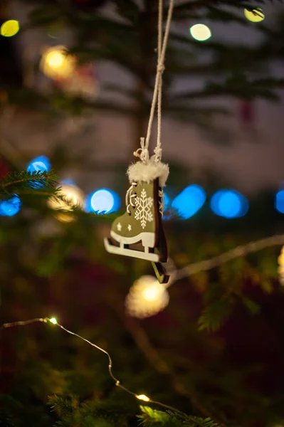 Vertical Shot Small Wooden Ice Skates Christmas Ornament Tree Blurry — Stock Photo, Image