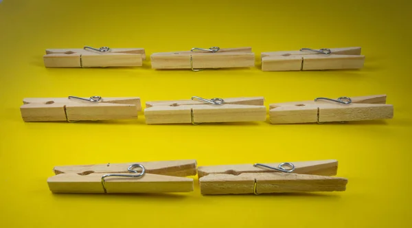 Closeup Shot Wooden Clothespins Yellow Background — 스톡 사진