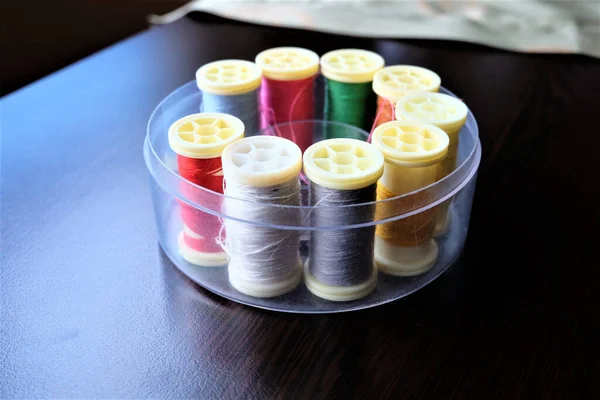 Multicolored Sewing Threads Plat Wooden Table — Stock Photo, Image