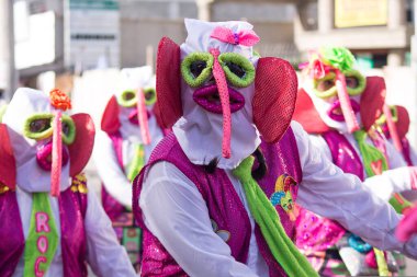 BARRANQUILLA, COLOMBIA - Feb 13, 2018: A group of characters from Monocuco pass through the cheerful troupe of the Battle of Flowers of the Barranquilla Carnival clipart