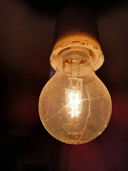 Closeup Vertical Shot Old Dusty Illuminated Bulb Lamp — Stock Photo, Image