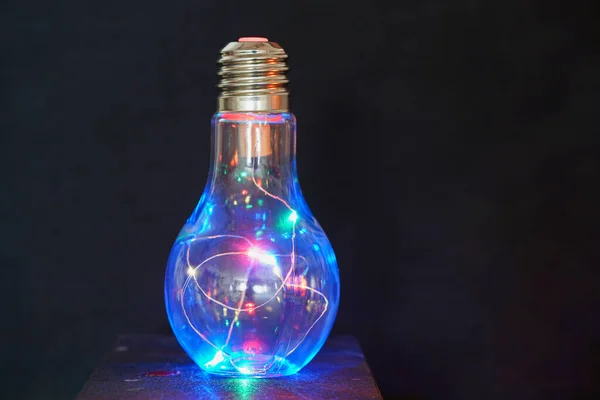 Closeup Light Bulb Illuminated Lights Dark Background — Stock Photo, Image