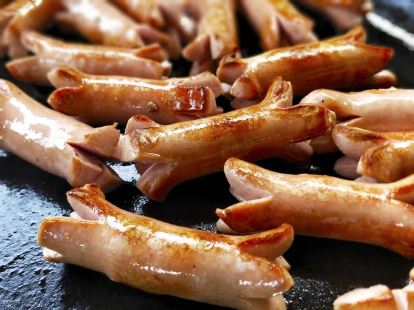 Closeup Delicious Cut Sausages Frying Pan Blurry Background — Stock Photo, Image