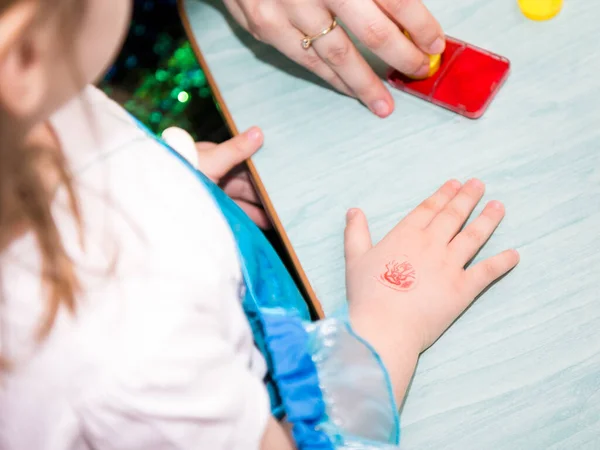 A temporary tattoo on a kid\'s hand