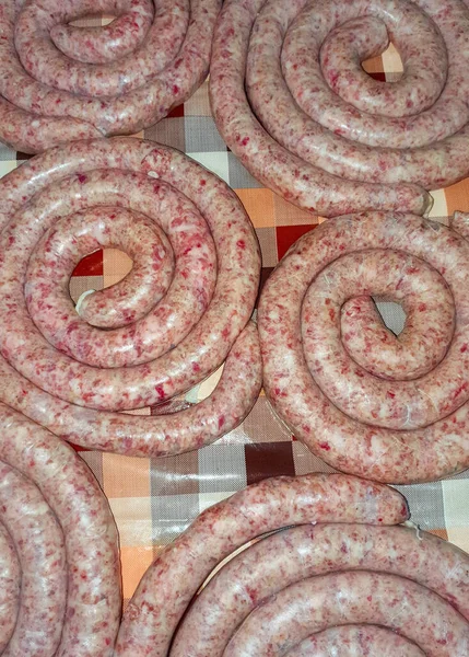 Vertical Shot Uncooked Sausage Spirals Kitchen Table — Stock Photo, Image
