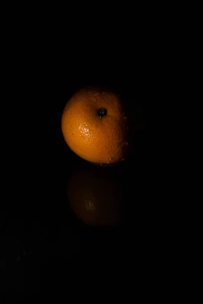 Vertical Closeup Orange Isolated Black Background Shadows — Stock Photo, Image