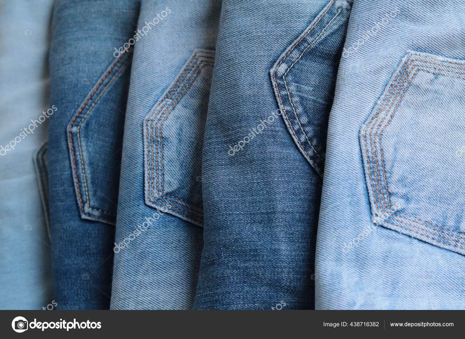 Rolled Jeanses of Different Shades on Denim Background. Close-up Stock  Image - Image of closeup, abstract: 169780377