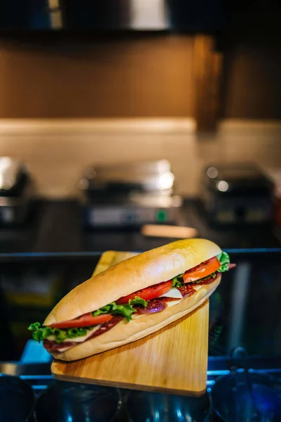 Closeup Delicious Fresh Sandwich Salami Veggies Wooden Table — Stock Photo, Image