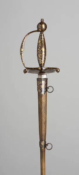 A vertical shot of an ancient sword isolated on gray background