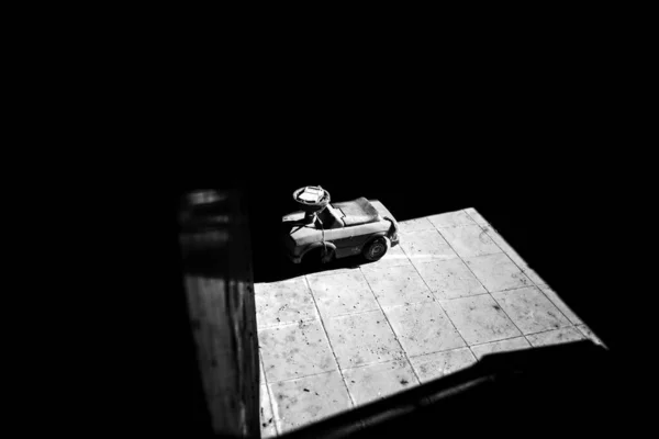 Grayscale Shot Small Toy Car Wooden Floor — Stock Photo, Image