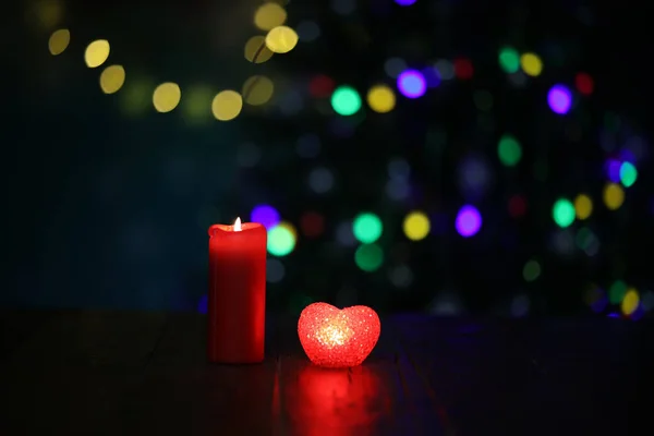 Christmas Composition Burning Candle Small Heart Shaped Lamp Bokeh Effect — Stock Photo, Image