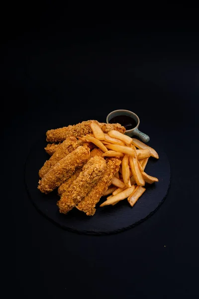 Closeup Shot Tasty Looking Dish Fried Chicken Fries Isolated Black — Stock Photo, Image