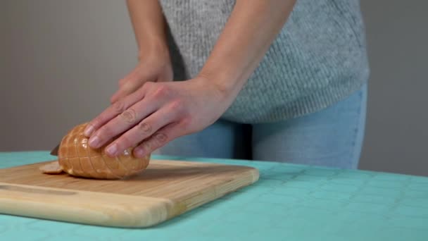 Young Woman Cutting Chicken Stuffed Cheese Ham Wooden Board — Stock Video