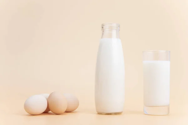 Bottle Glass Milk Some Eggs Orange Surface — Stock Photo, Image