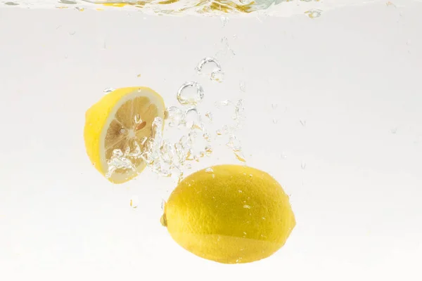Lemons Bubbling Water White Background — Stock Photo, Image