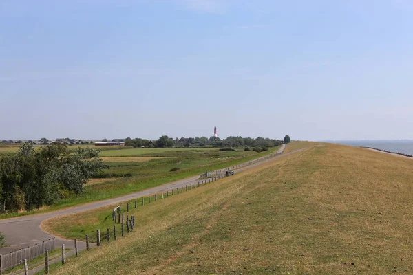 Closeup Shot Field Road Lighthouse Background — Stock Photo, Image