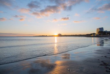 A beautiful view of the sunrise at Timmendorfer Strand, Germany clipart