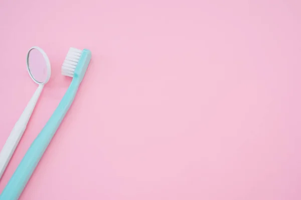 Blue Toothbrush Next Dental Mouth Mirror Pastel Pink Surface Copy — Stock Photo, Image