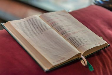 A selective focus closeup of a Songbook at St. Canice's Cathedral  in Kilkenny city, Ireland clipart