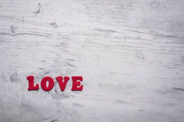 Eine Mit Roten Filzbuchstaben Geschriebene Inschrift Love Grauen Hintergrund Mit — Stockfoto