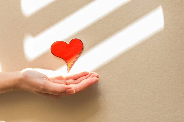 Female Hand Holding Red Heart Giving Some Love Valentine Day — Foto de Stock