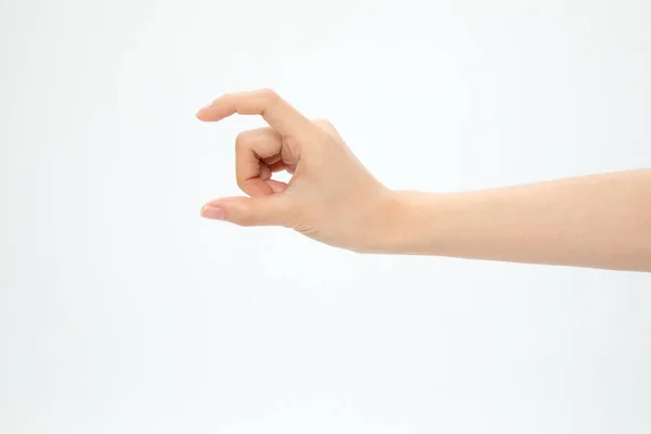 Close Uma Mão Mostrando Tamanho Pequeno Isolado Fundo Branco — Fotografia de Stock