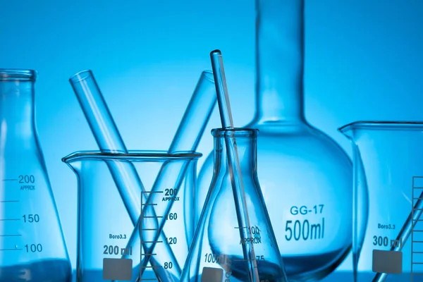 Variety Glass Flasks Lab Equipment Blue Background — Stock Photo, Image