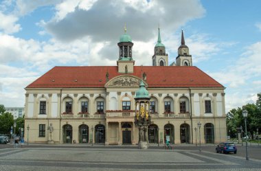 MAGDEBURG, GERMANY - May 16, 2016: Germany, May 14, 2016. The old town hall of Magdeburg is located on the old market in the center of the city. clipart