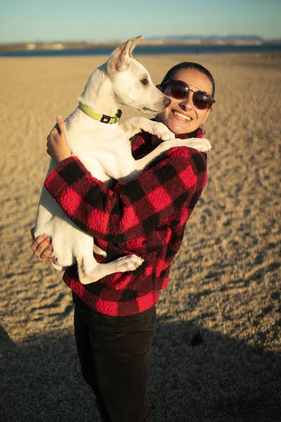 Shallow Focus Shot Female Sunglasses Playing Her White Dog Beach — Stock Photo, Image