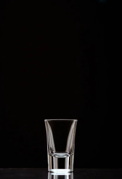 Vertical Shot Empty Shot Glass Isolated Black Background — Stock Photo, Image