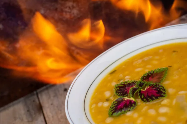 Bowl Delicious Pumpkin Soup Fire Emphasizing Spicy Taste Vegan Food — Stock Photo, Image