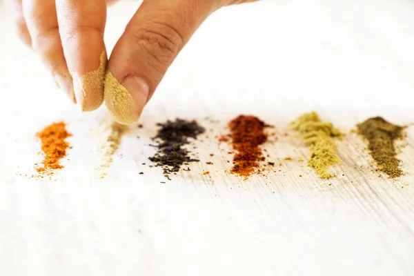 Humano Poniendo Diferentes Especias Colores Mesa Madera Blanca — Foto de Stock