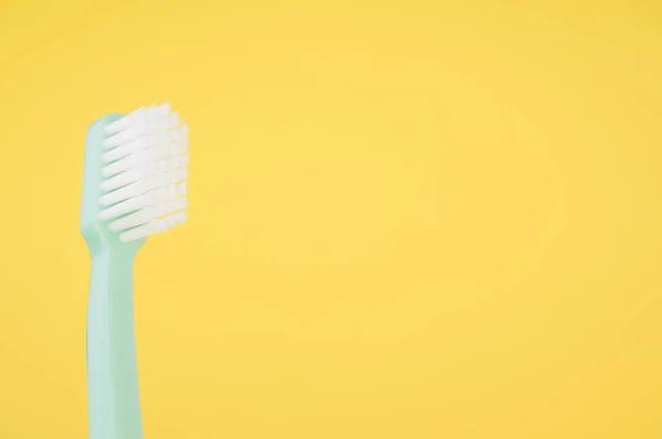 Closeup Toothbrush Isolated Yellow Background Empty Space Text — Stock Photo, Image
