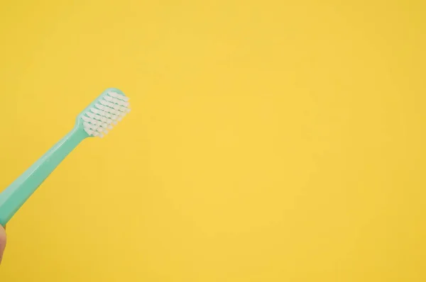 Closeup Toothbrush Isolated Yellow Background Empty Space Text — Stock Photo, Image