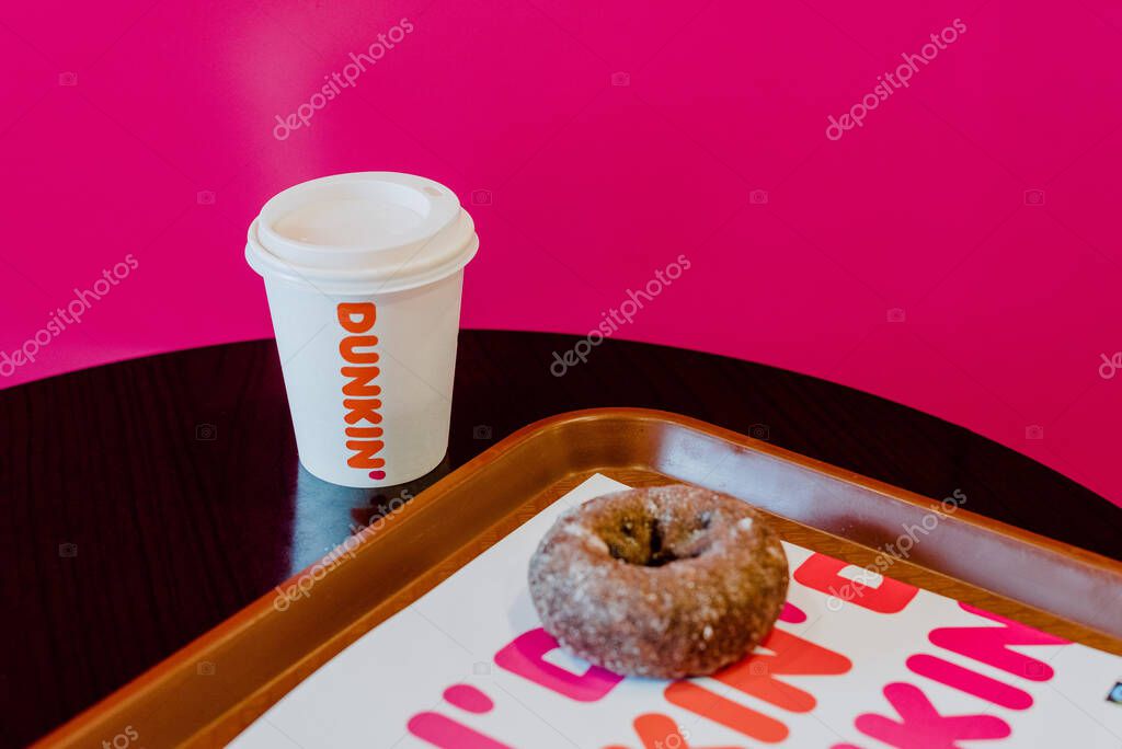 MADRID, SPAIN - Jan 21, 2021: Dunkin donuts is an American global doughnut company and coffee house chain.