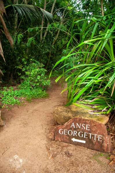 stock image A vertical shot of a sign showing the direction to Anse Georgette beach in Praslin Island