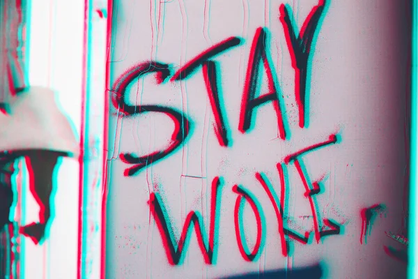 Closeup Shot Stay Woke Sign Textured Wall Pink Blue Shades — Stock Photo, Image