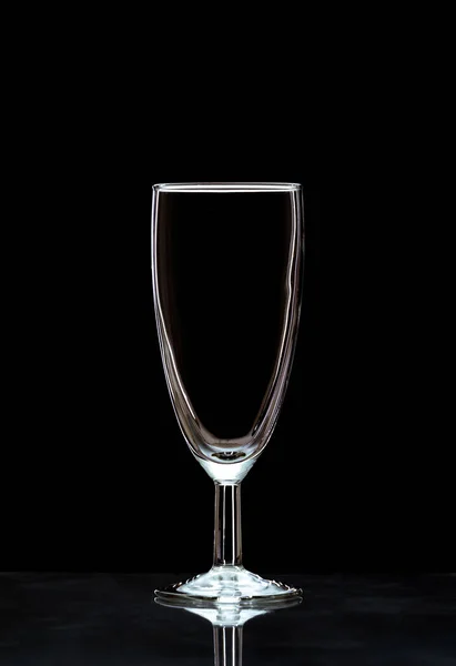 Vertical Closeup Empty Champagne Glass Reflective Surface Isolated Black Background — Stock Photo, Image